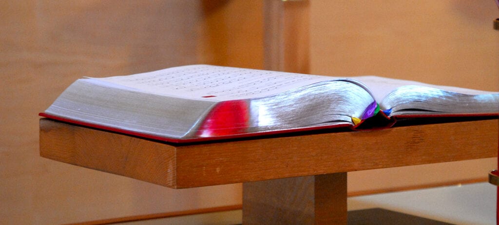 Opened Bible placed on top of a church podium