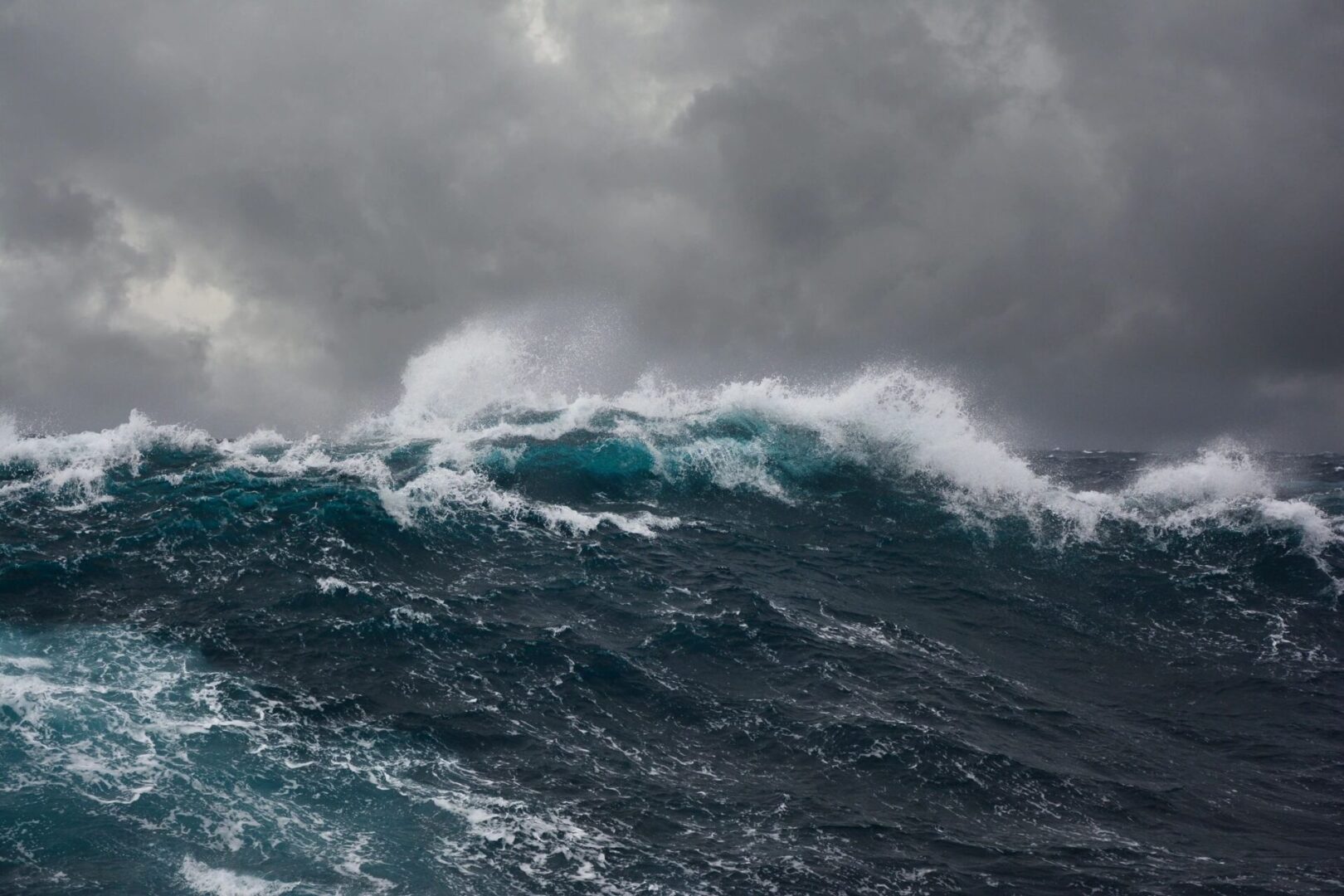 Stormy ocean waves under a dark, cloudy sky. Stormy ocean waves under a dark, cloudy sky.