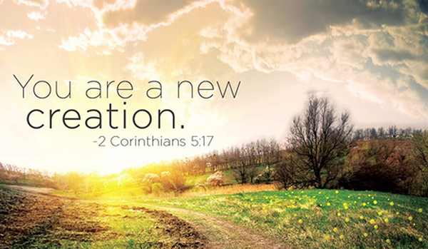 A sunrise over a field with an inspirational Bible verse about new creation.